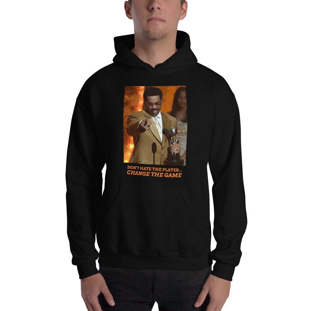 
                  
                    Load image into Gallery viewer, Male modeling Black Pullover Hoodie with image of Steve Harvey winning award pointing with the words &amp;quot;Don&amp;#39;t Hate The Player... Change The Game&amp;quot; below the image
                  
                