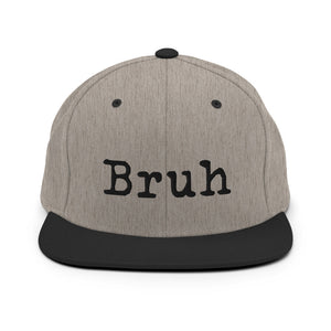 
                  
                    Load image into Gallery viewer, Grey Snapback hat with the word &amp;quot;Bruh&amp;quot; in black typewriter text on the front with black brim
                  
                
