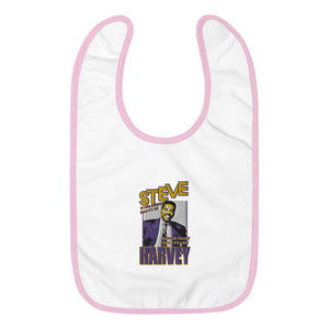 
                  
                    Load image into Gallery viewer, White Baby Bib and pink trim with Steve Harvey image and Steve in Yellow with Purple outline and Harvey in purple with yellow outline and &amp;quot;Your Dream Has to Be Bigger Than Your Fears&amp;quot;
                  
                