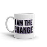 Image of white mug with "I Am The Change" font is black with purple outline and shadowing