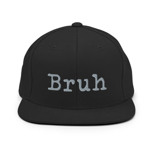 
                  
                    Load image into Gallery viewer, Black Snapback hat with the word &amp;quot;Bruh&amp;quot; in grey typewriter text on the front
                  
                