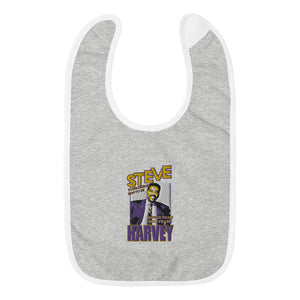 
                  
                    Load image into Gallery viewer, Grey Baby Bib with Steve Harvey image and Steve in Yellow with Purple outline and Harvey in purple with yellow outline and &amp;quot;Your Dream Has to Be Bigger Than Your Fears&amp;quot;
                  
                