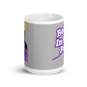 
                  
                    Load image into Gallery viewer, 11 oz White coffee mug showing part of the vintage Steve Harvey image and Logo on the left and part of Believe phrase showing on the right
                  
                