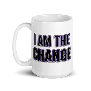 
                  
                    Load image into Gallery viewer, Image of white mug with &amp;quot;I Am The Change&amp;quot; font is black with purple outline and shadowing
                  
                