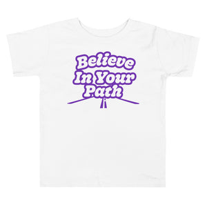 
                  
                    Load image into Gallery viewer, White Toddler T-Shirt with Believe In Your Path written in white with purple outline and road graphic at the bottom
                  
                