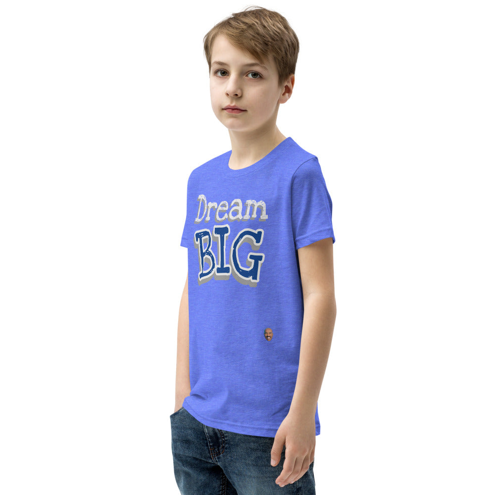 
                  
                    Load image into Gallery viewer, Male child modeling Children&amp;#39;s Blue T-Shirt The words &amp;quot;Dream Big&amp;quot; in Blue with yellow outline side view
                  
                