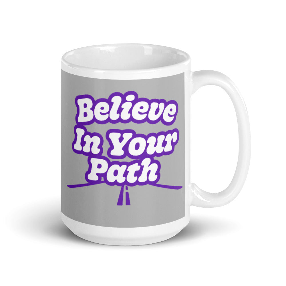 
                  
                    Load image into Gallery viewer, 11 oz White coffee mug with Blieve In Your Path text in white with purple outline and road graphic on grey background
                  
                