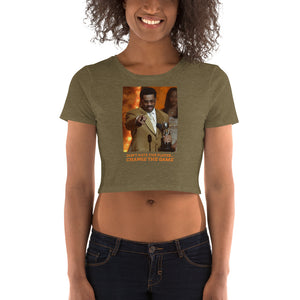 
                  
                    Load image into Gallery viewer, Female modeling Military Green Crop T-Shirt with image of Steve Harvey winning award pointing with the words &amp;quot;Don&amp;#39;t Hate The Player... Change The Game&amp;quot; below the image
                  
                