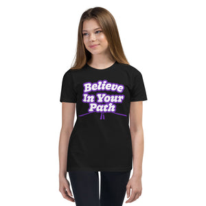 
                  
                    Load image into Gallery viewer, Youth Female modeling Youth Black T-Shirt with Believe In Your Path in white text with purple outline with road graphic
                  
                