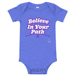 Blue baby onesie with Believe In Your Path text in white with purple outline and a road graphic at the bottom with Steve Harvey Head and Mustache outline in bottom corner