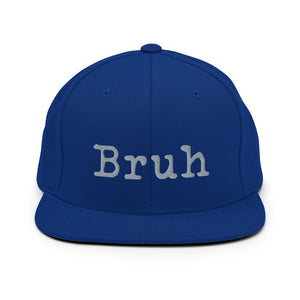 
                  
                    Load image into Gallery viewer, Blue Snapback hat with the word &amp;quot;Bruh&amp;quot; in grey typewriter text on the front
                  
                