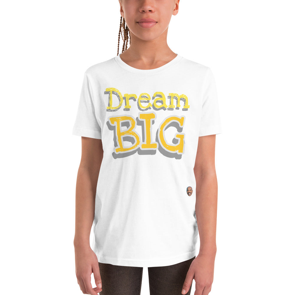 Female child modeling Children's White T-Shirt The words "Dream Big" in yellow with white outline
