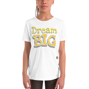 
                  
                    Load image into Gallery viewer, Female child modeling Children&amp;#39;s White T-Shirt The words &amp;quot;Dream Big&amp;quot; in yellow with white outline
                  
                