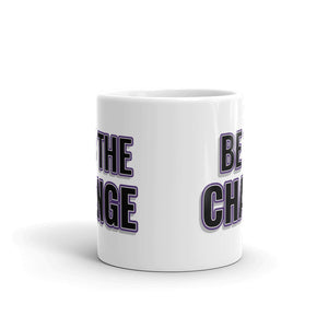
                  
                    Load image into Gallery viewer, Image of white mug with &amp;quot;I Am The Change&amp;quot; font is black with purple outline and shadowing side view shoing writing on both sides of mug
                  
                
